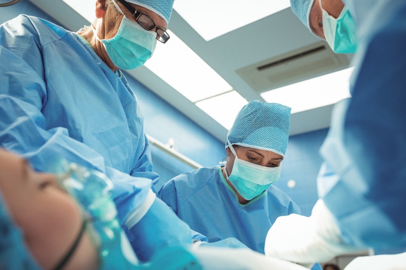 Operating room with doctors and patients using PPE's